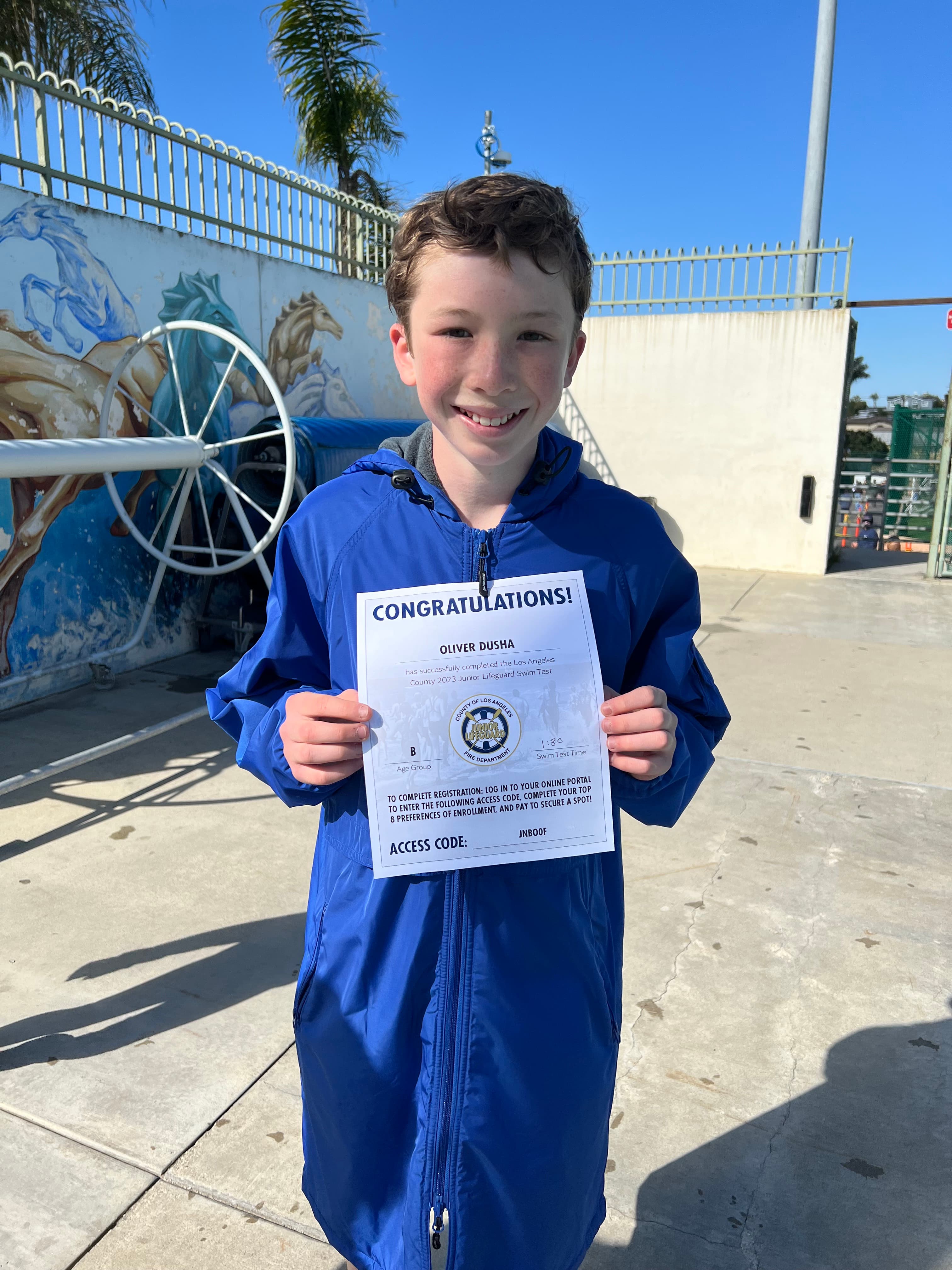 Junior Lifeguard candidate with his swim test certificate